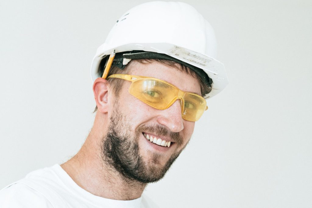 A Man Wearing a Hard Hat and Googgles